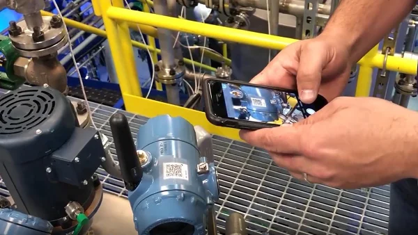 QR Code on industrial equipment being scanned with a smartphone
