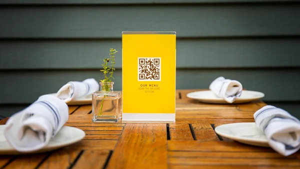 QR Code printed on a restaurant menu stand