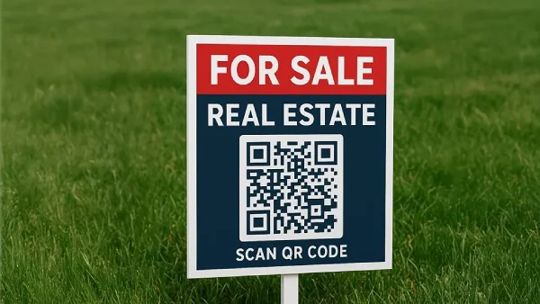 QR Code on a real estate for-sale sign on a grass lawn